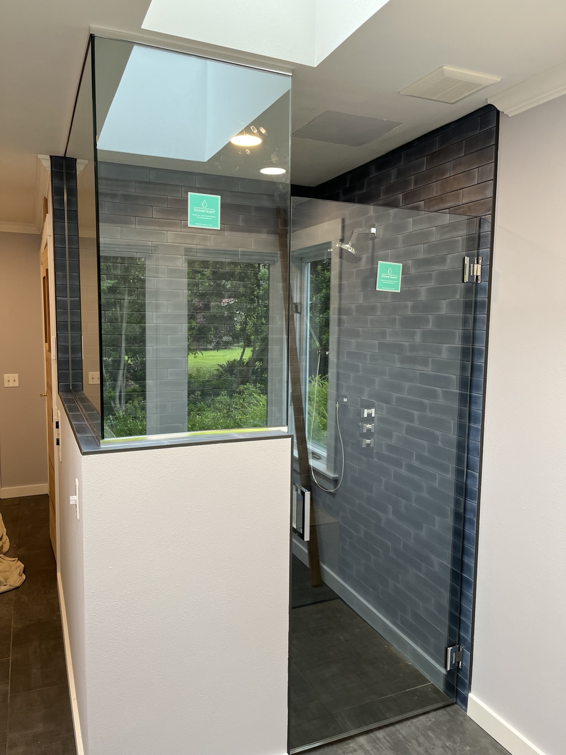 Custom frameless shower enclosure by Simmons Glass